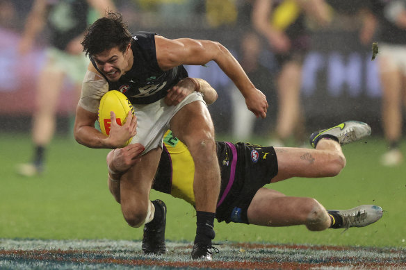 Nick Vlastuin chases down Carlton’s Jack Silvagni.