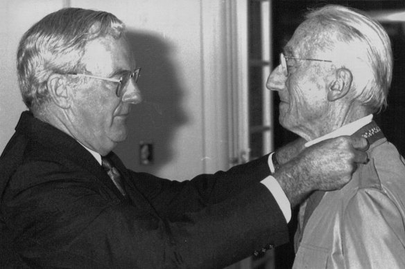 Captain Jacques Yves Cousteau gets investiture of Honorary award from Gov. Gen. Bill Hayden in Canberra Today. February 20, 1990. 