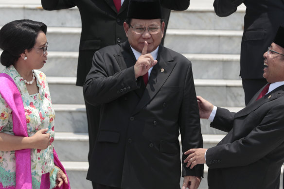 Shares concerns about regional stability: Indonesian Defence Minister Prabowo Subianto, centre, shares a light moment with Foreign Minister Retno Marsudi, left, and State Secretary Pratikno after his swearing-in ceremony last year. 