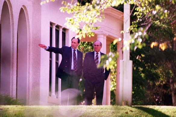 Paul Keating shows the prime minister-elect John Howard around The Lodge in Canberra, 1996.