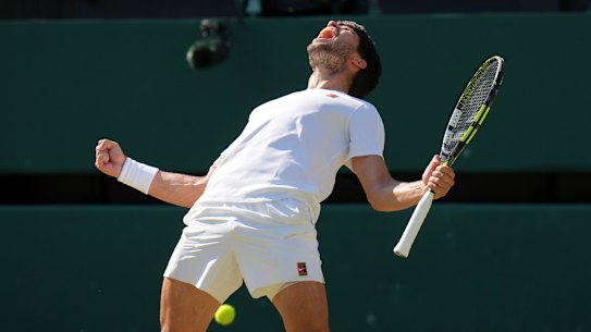 Carlos Alcaraz celebrates outlasting Taylor Fritz in four tight sets to reach a third Wimbledon final in a row.