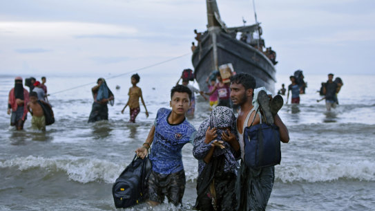 Ethnic Rohingya disembark from their boat upon landing in Ulee Madon, on the north coast of Sumatra, Indonesia, in November.