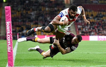 Dragons winger Mikaele Ravalawa crashes over for one of his two tries against the Broncos.