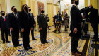 Democratic House impeachment managers stand before entering the Senate Chamber as they deliver to the Senate the article of impeachment alleging incitement of insurrection against former President Donald Trump.