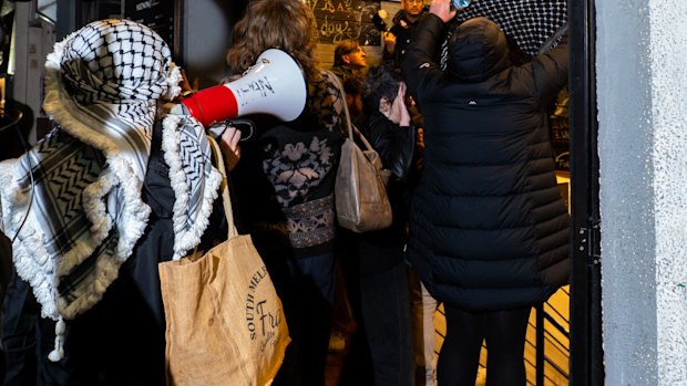 A group storms Miznon restaurant in Hardware Lane on Friday night.