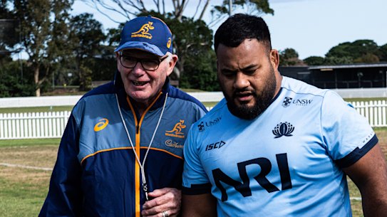 Walalbies props Taniela Tupou and Angus Bell last year with coach Mike Cron in Sydney
