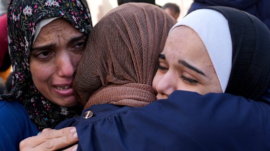 Palestinians mourn relatives killed in the Israeli bombardment of the Gaza Strip in front of the morgue in Deir al Balah.
