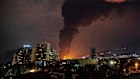 Flames and smoke rise from an oil storage facility in Tehran.