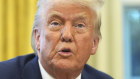 President Donald Trump speaks before signing an executive order in the Oval Office of the White House.
