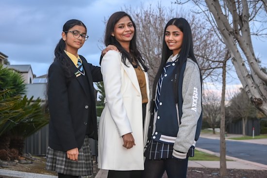 Poonam Singh with her daughters Kashvi and Prisha, who commute for more than ten hours a week - each - to get to and from their respective schools. 