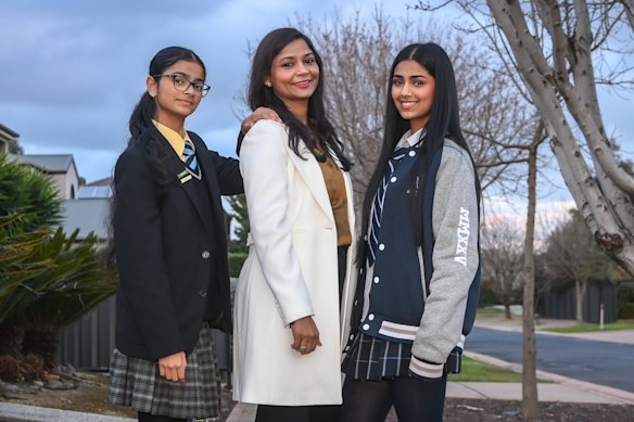Poonam Singh with her daughters Kashvi and Prisha, who commute for more than ten hours a week - each - to get to and from their respective schools. 