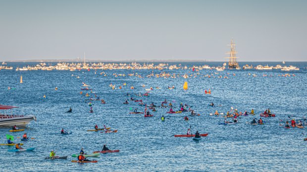 Thousands of swimmers took off from Cottesloe Beach in Perth on Saturday morning in the 33rd Rottnest Channel Swim.