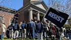 Students, faculty and members of the Harvard University community rally against the Trump administration.