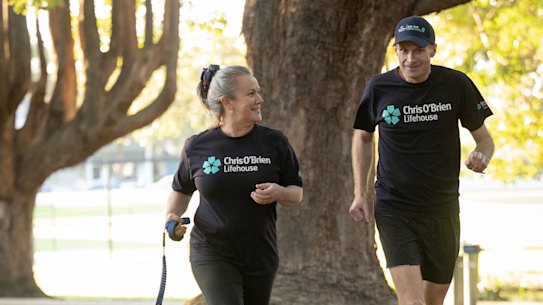 Richard Scolyer and his wife, Katie Nicoll, take their dog Cha Cha for a run ahead of the City2Surf on Sunday.