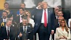 President Donald Trump salutes as attends a military parade commemorating the Army’s 250th anniversary, coinciding with his 79th birthday, Saturday, June 14, 2025, in Washington, as Secretary of the Army Daniel Driscoll, Defense Secretary Pete Hegseth, and first lady Melania Trump, watch.