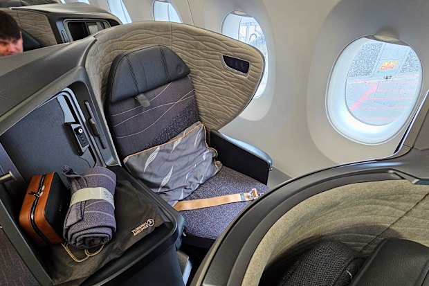 The seat has direct aisle access, but feels tight.