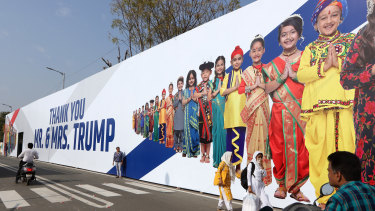 Slum residents have criticised the building of a 500-metre-long wall that hides their community and poverty from the Trumps.