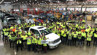 Workers celebrate production of the 1500th Ram pick-up truck.