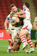 The Dragons halfback makes a tackle on Sunday night.