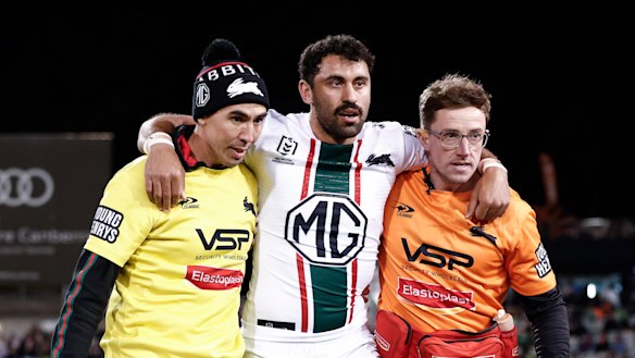 Alex Johnston is helped off after injuring his Achilles in Canberra.