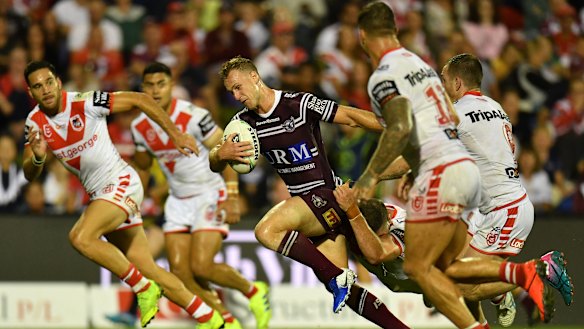 Leadership material: Daly Cherry-Evans pushes through the Dragons defence.