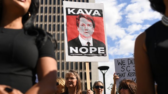 Survivors of sexual assault and members of rights groups rally in Denver against Brett Kavanaugh's nomination to the US Supreme Court.