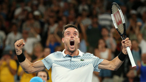 Epic: Roberto Bautista Agut celebrates his five-set win over John Millman.