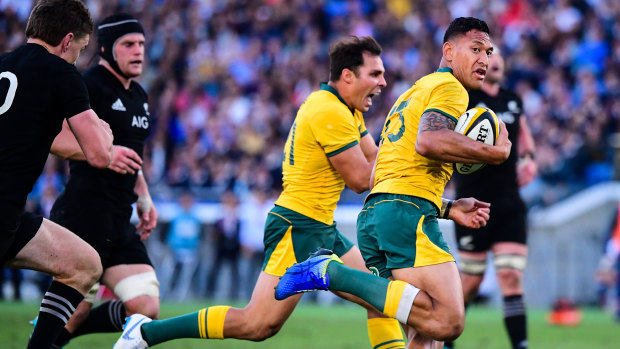 Consolation: Israel Folau races away to score but the deficit was already too large.