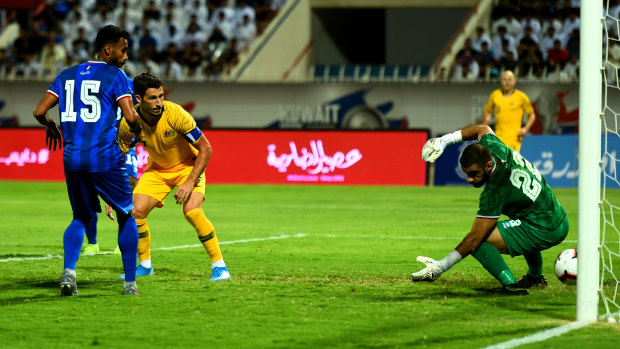 First blood: Matthew Leckie scores the opening goal at Kuwait Club Stadium.