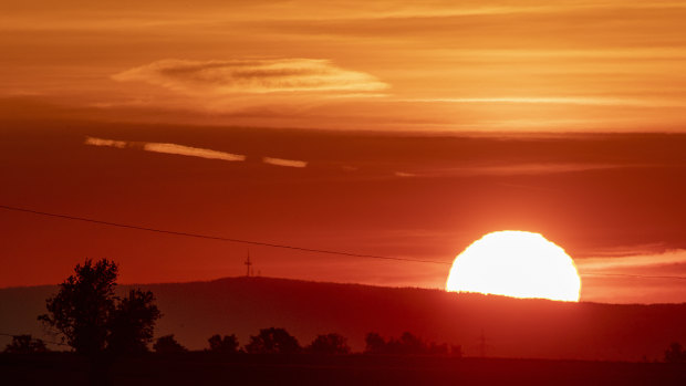 The sun rises in Frankfurt, Germany.