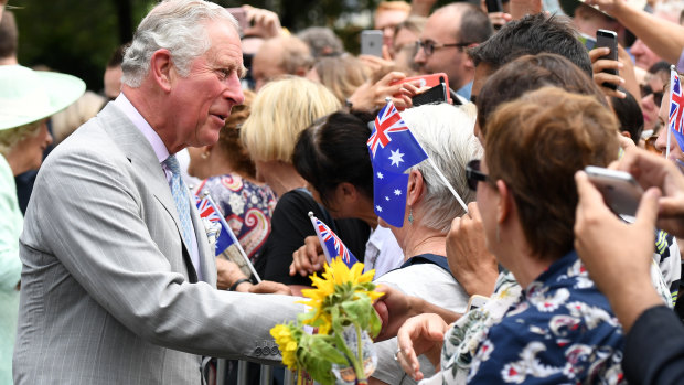 Prince Charles is greeted by members of the public during a visit to Brisbane.