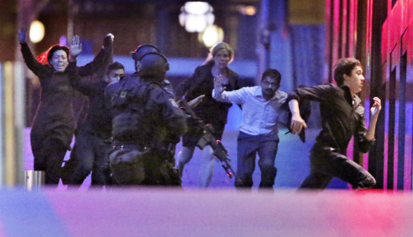 Six hostages escape from the Lindt Cafe, at 2.03 a.m. December 16, 2014. 