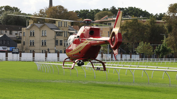 A helicopter tries to dry the Royal Randwick track before the second day of The Championships.