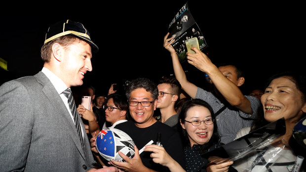 Amazing welcome: All Blacks star Beauden Barrett signs autographs during a New Zealand welcome ceremony at Zojoji Temple in Tokyo.