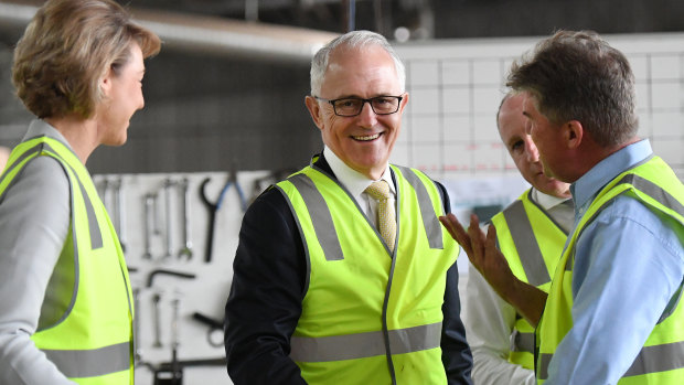 Malcolm Turnbull and Michaelia Cash chatting to Michael Kennedy of Kennedy's Timber in Narangba, Brisbane.