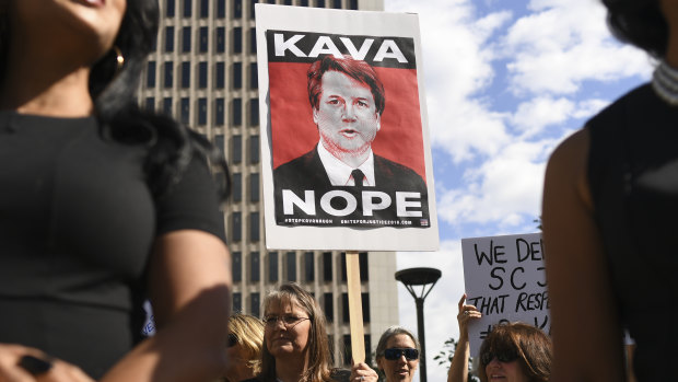 Survivors of sexual assault and members of rights groups rally in Denver against Brett Kavanaugh's nomination to the US Supreme Court.