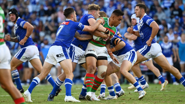 Tevita Tatola charges into the Bulldogs defence on Good Friday, despite having suffered a kneee injury in the opening exchanges.