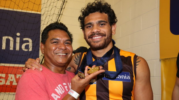 Cyril Rioli celebrates with his father after the 2015 premiership.