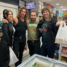 Redfern Convenience Store owner Hazem Sedda with members of the band Peking Duk .