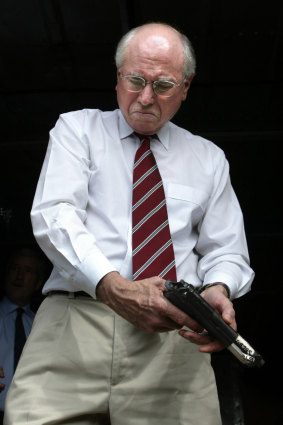 Prime Minister John Howard in the Solomon Islands inspecting some guns that were handed in, 2003.
