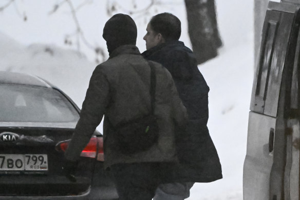 Wall Street Journal reporter Evan Gershkovich, right, is escorted to the Lefortovsky court in Moscow.