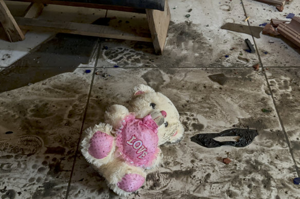 A teddy bear is seen on the floor following an Israeli airstrike on a refugee camp in Gaza.