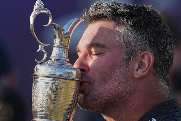 Fox kisses the Claret Jug trophy after winning the British Open. 