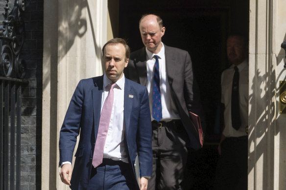 Britain's Health Secretary Matt Hancock (left) and Chief Medical Officer Chris Whitty outside 10 Downing Street on May 4.