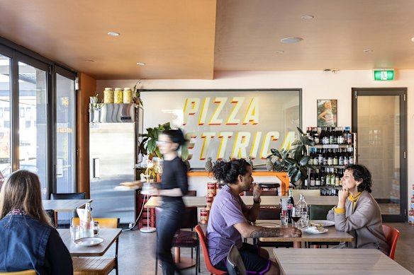Pizza parlour Pizza Elettrica has some kitschy 1980s suburban touches.