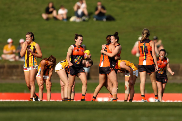 GWS players celebrate at the final siren.