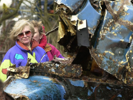  Tonia Bern-Campbell looks on as the wreckage of Donald Campbell’s jet-powered boat Bluebird is brought to shore at Coniston Water in England’s Lake District on  March 8, 2001. 
