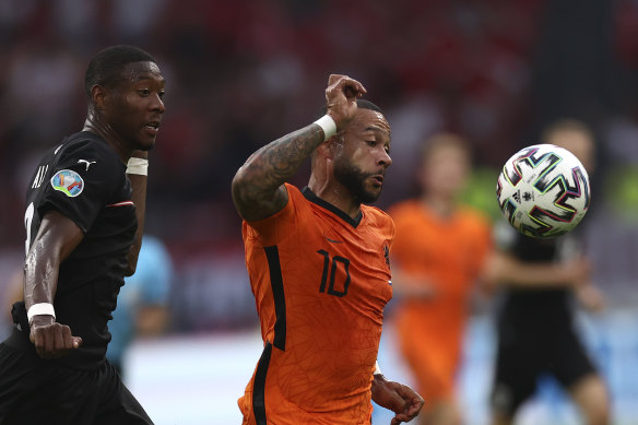 Memphis Depay, right, scored the opener for the Dutch from the spot after 10 minutes against Austria.