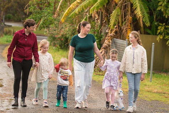 Mansell and Hopkins with their children Aubrey-Rose, 8, Brooklyn-Louise, 9 and Kennedy, 6, who were conceived through informal sperm donation, and Hendrix, 3, conceived through IVF.