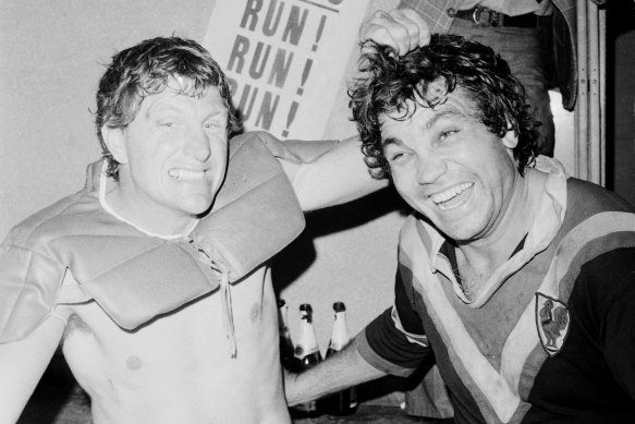 Eastern Suburbs stars Ron Coote (left) and Arthur Beetson share the joys of victory in the dressing room after the 1975 grand final between Easts and St George.